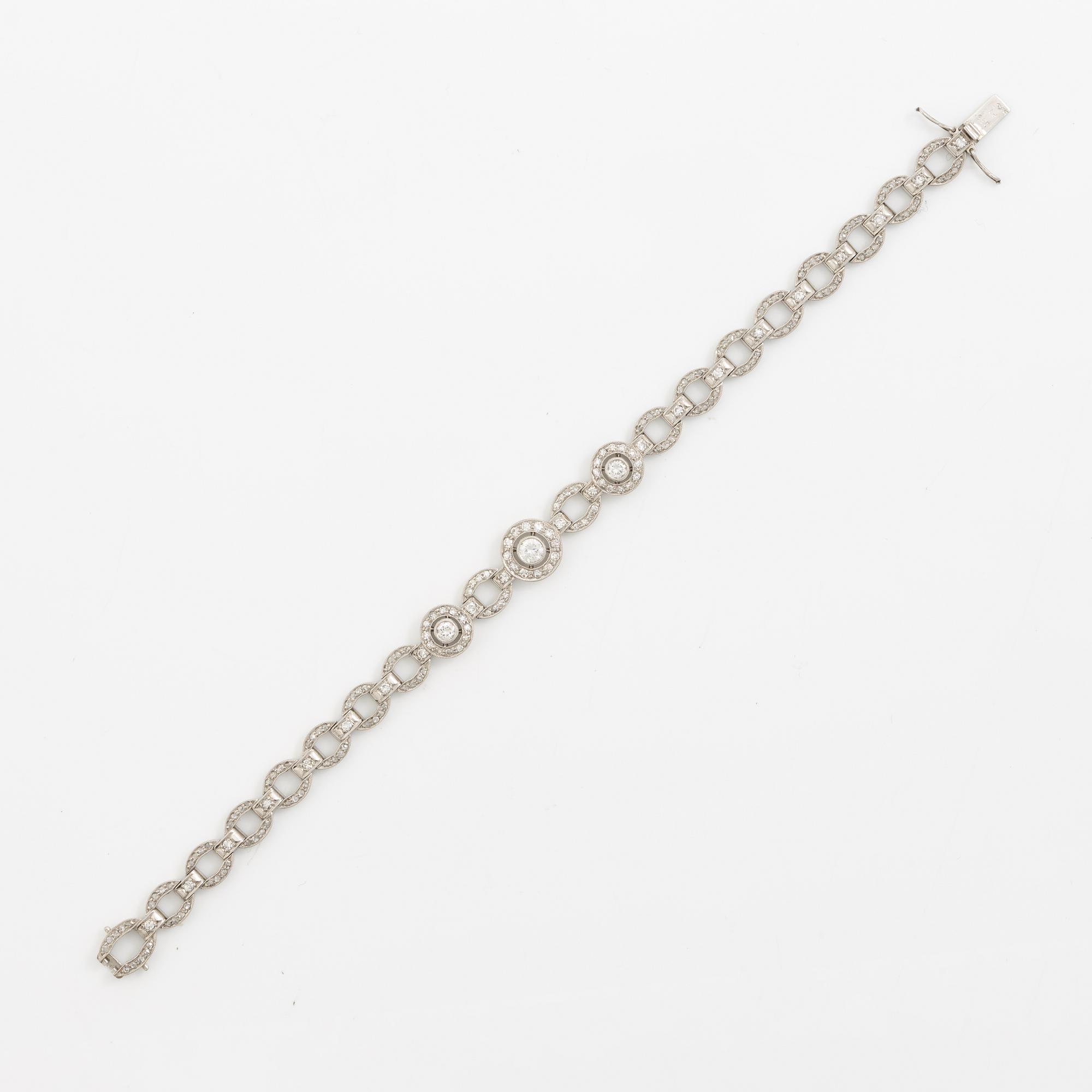 Bracelet in platinum set with round brilliant, octagonal, and rose-cut diamonds.