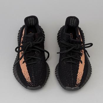 Adidas Yeezy Boost 350 V2 core black copper sneakers.