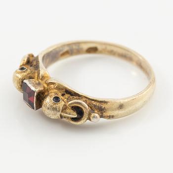 Two rings in silver with pink/red stones.