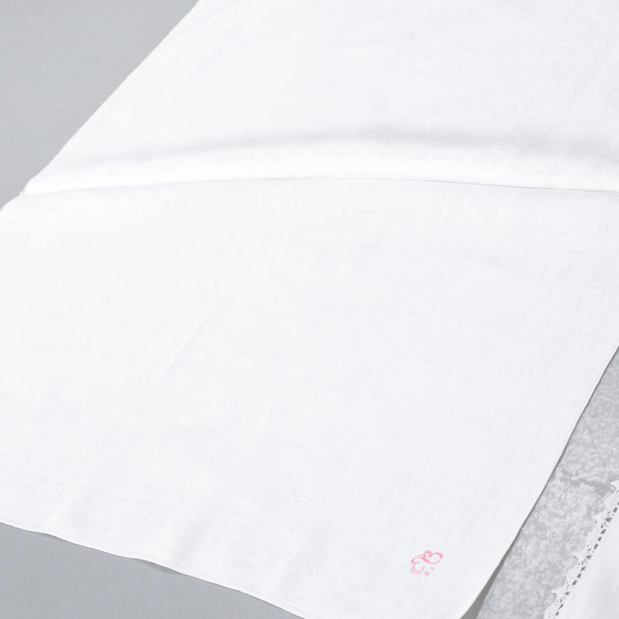 Three 19th century damask napkins.