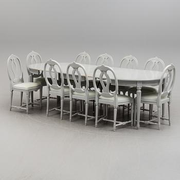 A Gustavian style dining table and ten chairs, 20th century.