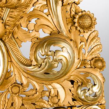 A MIRROR, Baroque style, circa 1900, gilt wood.