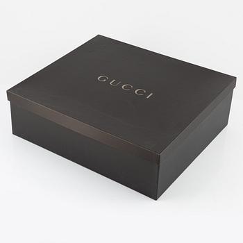 Gucci, an ostrich handbag.