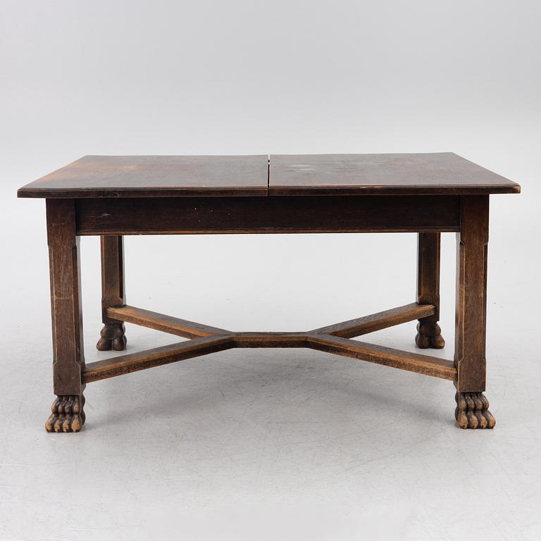 A Baroque-style dining table with six chairs, around 1900.