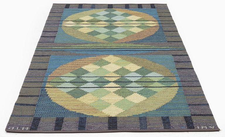 a carpet, flat weave, c 207 x 104.5 cm, signed JLH IMV.