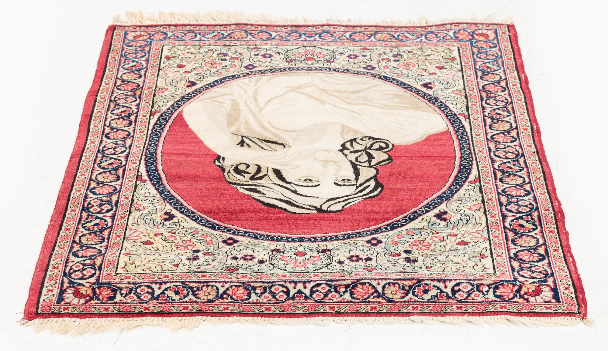 An antique pictoral Kerman Raver rug, c. 87 x 65 cm.