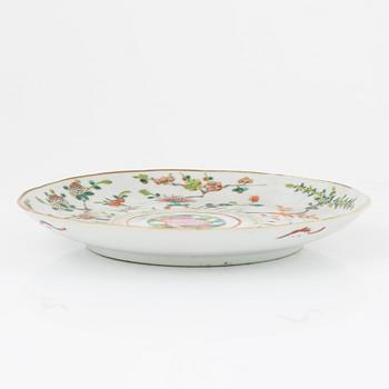 A set of three famille rose plates, Qing dynasty, circa 1900.