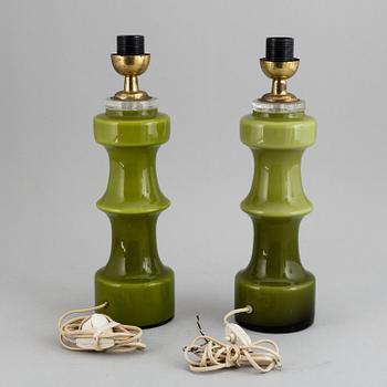 A pair of pea green glass 20th century table lamps.