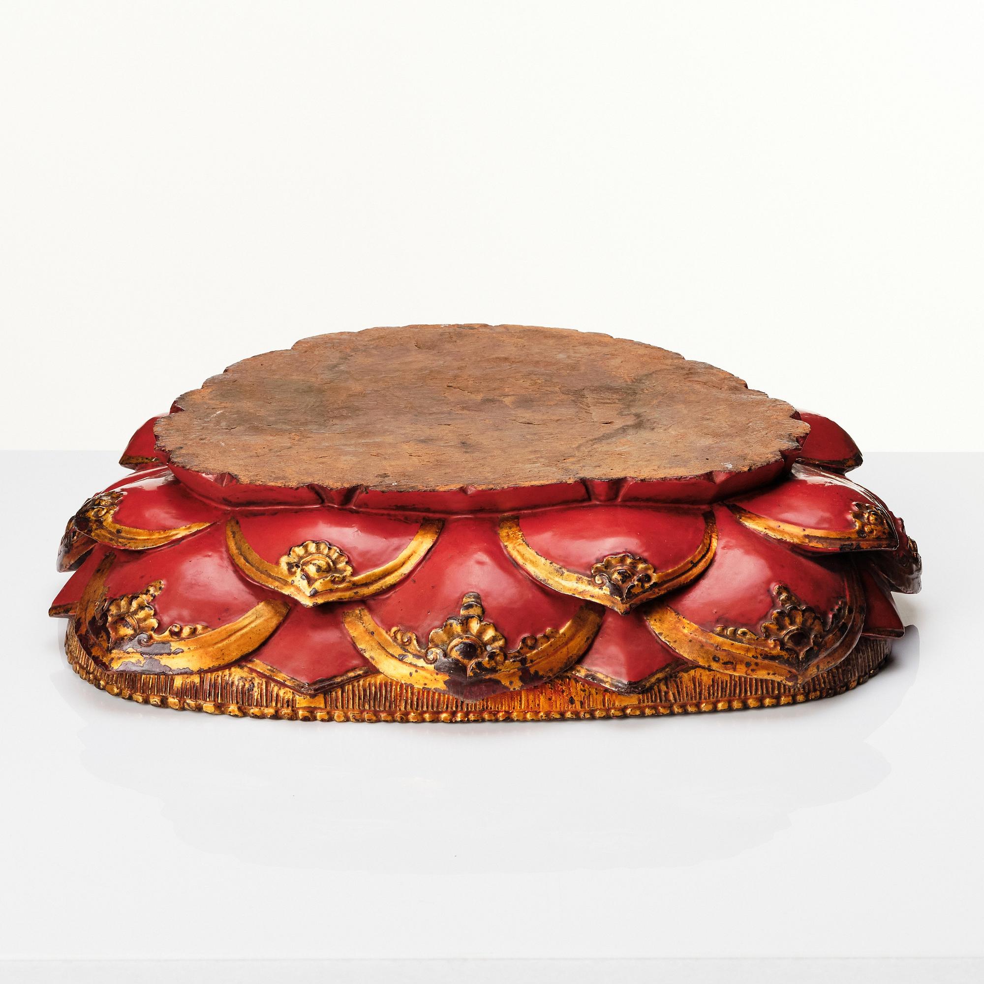 A large gilt and lacquered figure of a seated buddha, Qing dynasty, 19th Century.