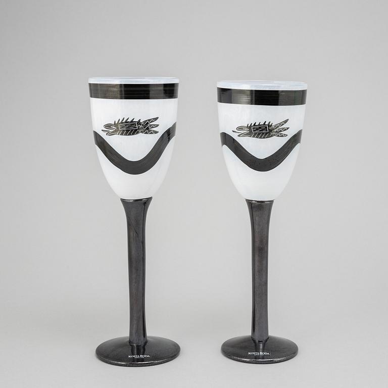 Ulrica Hydman-Vallien, a glass vase, goblet, and six glasses from Kosta Boda, signed and numbered.