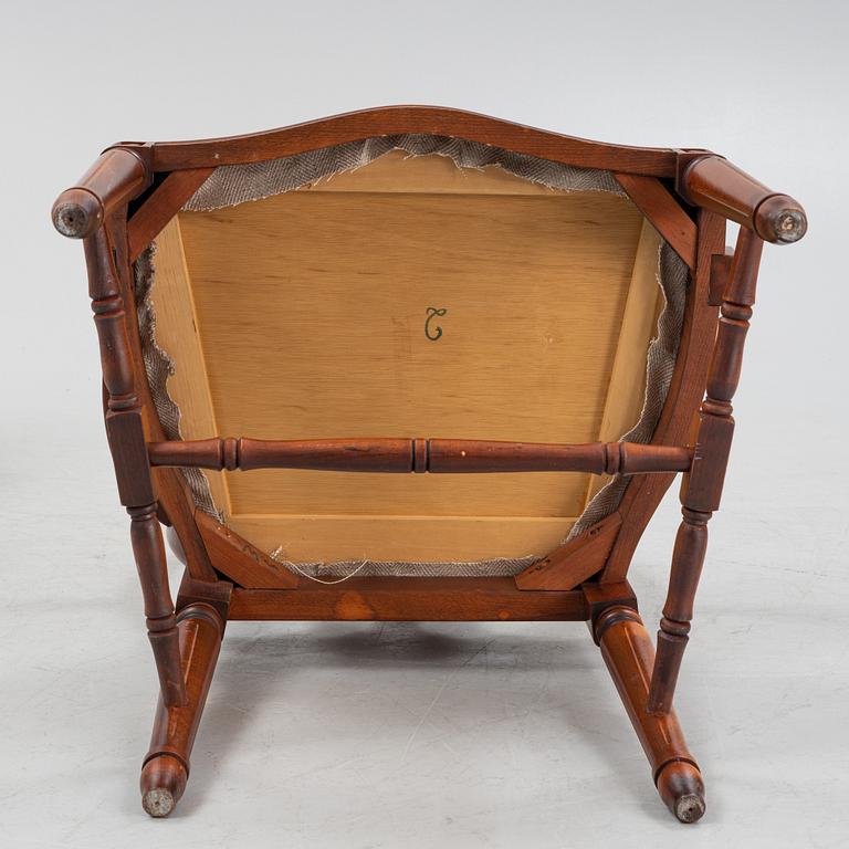 A Gustavian style dining table with two armchairs and four chairs, late 20th century.