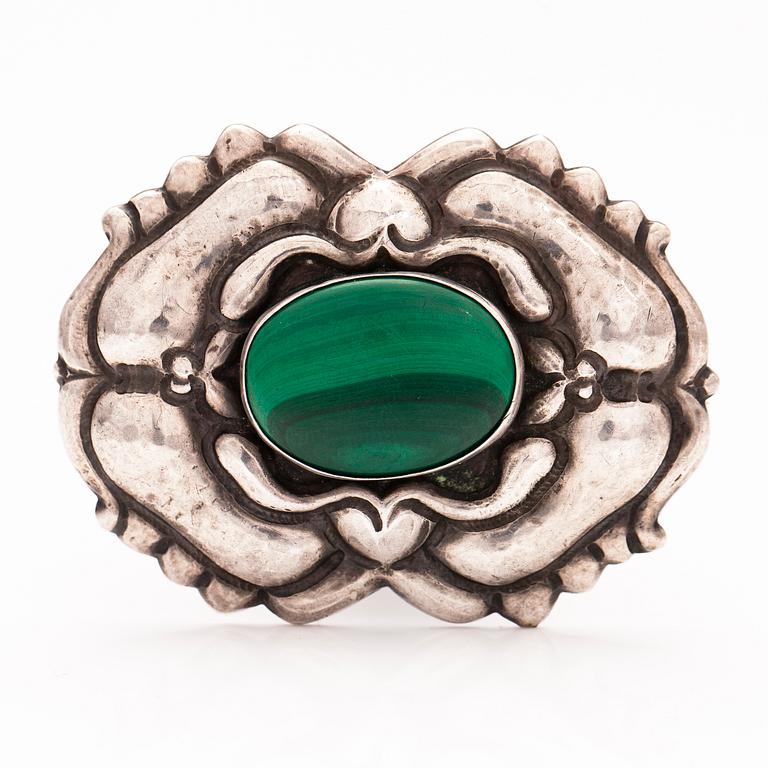 A jugend silver brooch with a malakite.