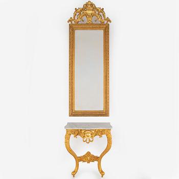 A second half of the 20th Century rococo style mirror with a console table.