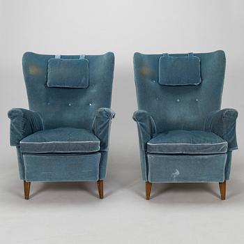 A pair of mid-20th century armchairs.
