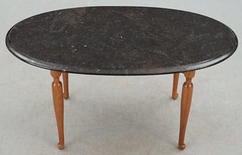 A Josef Frank stone top mahogany and walnut table, Svenskt Tenn.