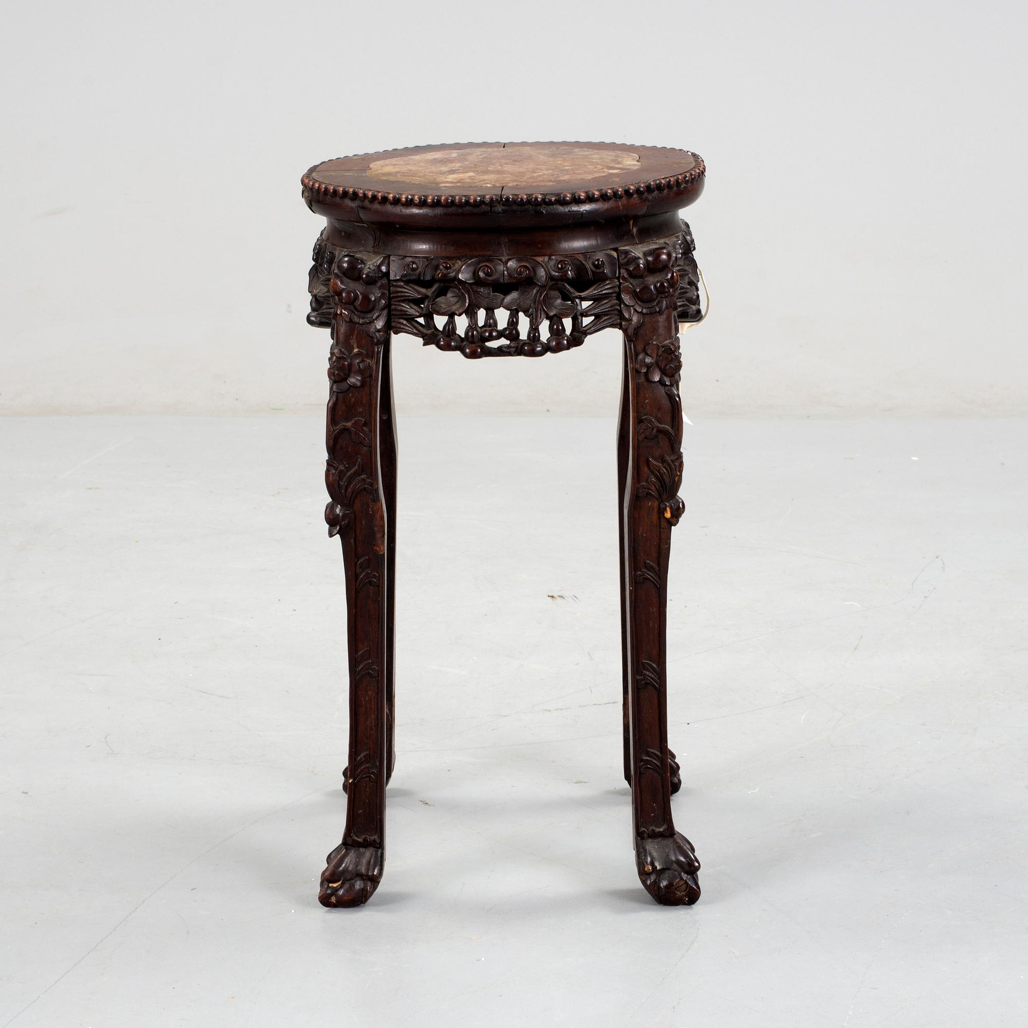 A hardwood table with marble top, China, 20th Century.