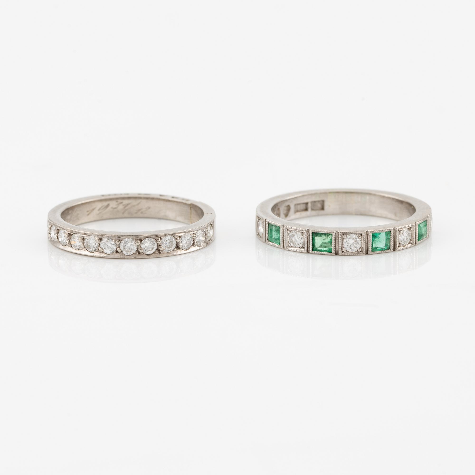 Rings, 2 pcs, alliance rings, 18K white gold with diamonds, one of them with diamonds and emeralds.
