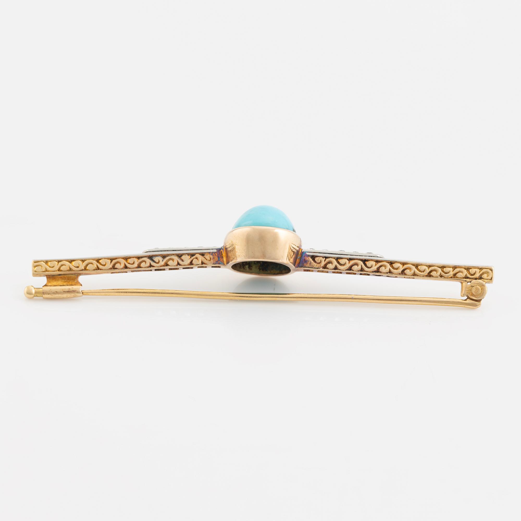 An 18K gold brooch set with a turquoise and old-cut diamonds.