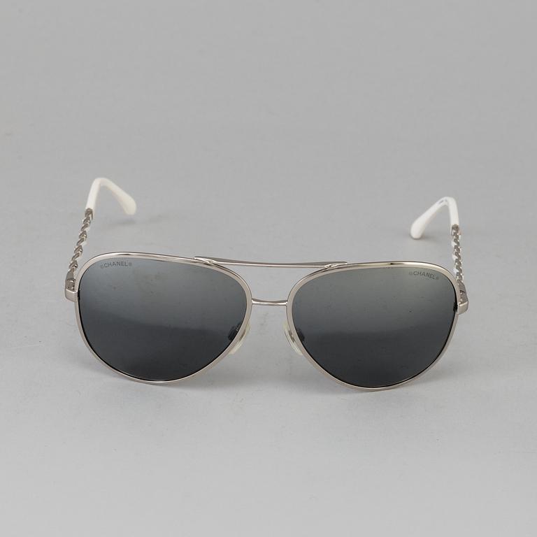 A pair of sunglasses by Chanel.