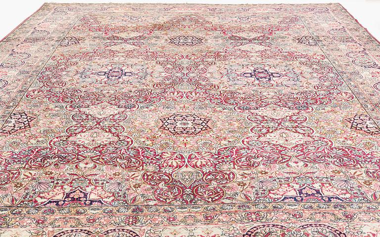 An antique Kerman Laver carpet, south east persia, ca 501 x 359 cm.