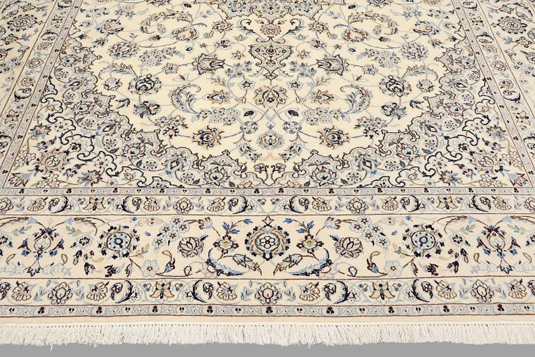 A carpet Nain, part silk, so-called 9LAA, c. 347 x 253 cm.