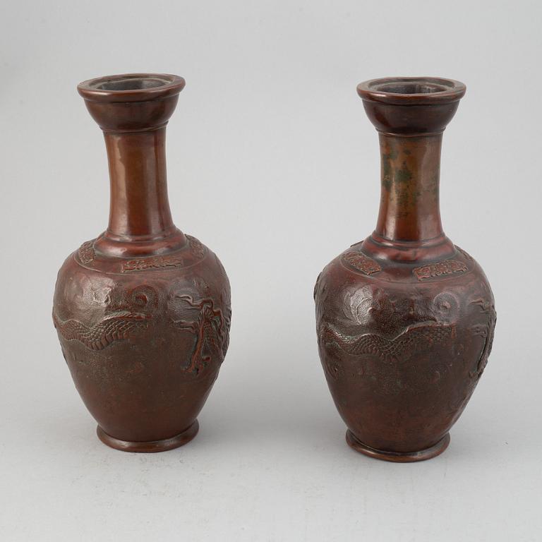 A pair of Japanese copper alloy temple vases, Meiji period (1868-1912).