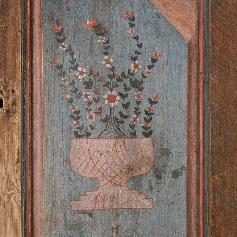 A folk-art cabinet attributed to  "Gammelmålaren" Anders Nilsson (Brunskog, 1807–1889).