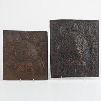 Two Tibetan copper reliefs, 20th century.