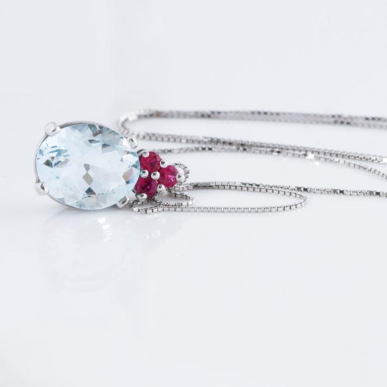A aquamarine and ruby pendant.