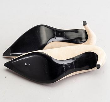 A pair of Balenciaga beige suede shoes size 38.