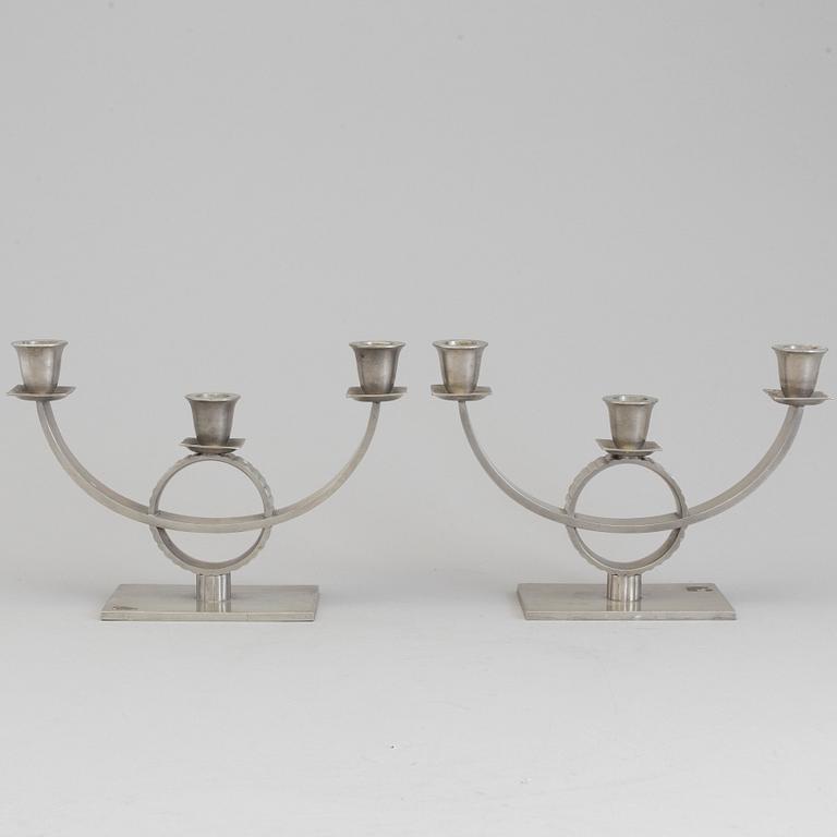 A pair of pewter candelabra, 1920's/30's.