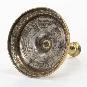 A candle holder in brass, Baroque, 17th/18th century.