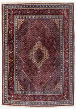 An oriental carpet, c. 371 x 264 cm.