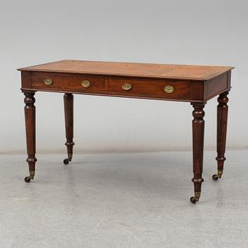 A late 19th century English writing table signed Holland & Sons.