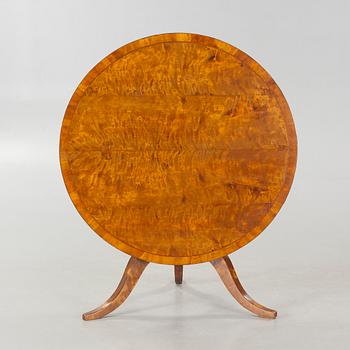 A 19th century drop-leaf table.