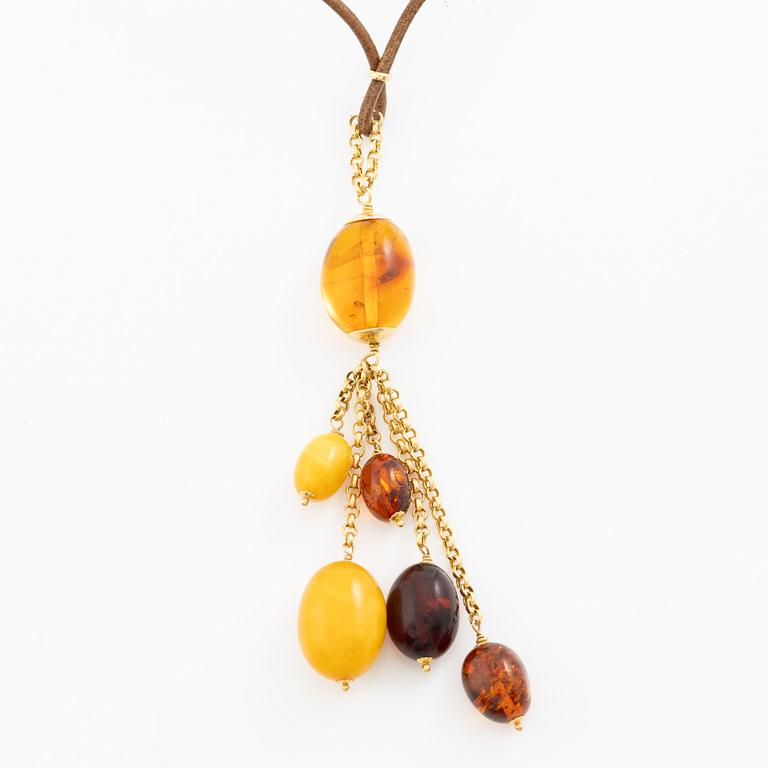 Necklace leather strap and 18K gold with amber.