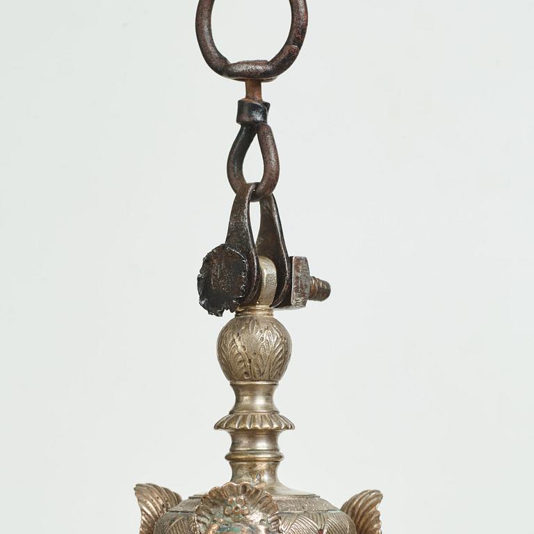 A Swedish silvered brass presumably late Baroque chandelier in the style of Jean Berain.