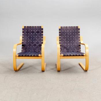 Alvar Aalto, a pair of birch armchairs model 406 21st century.