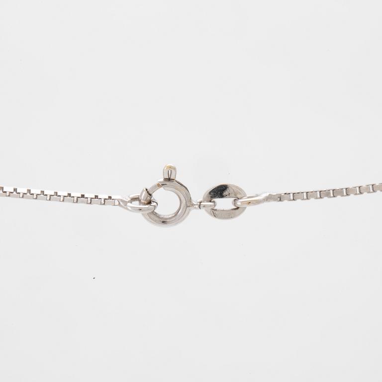 An 18K white gold necklace set with a drop-shaped cultured pearl and round brilliant-cut diamonds.
