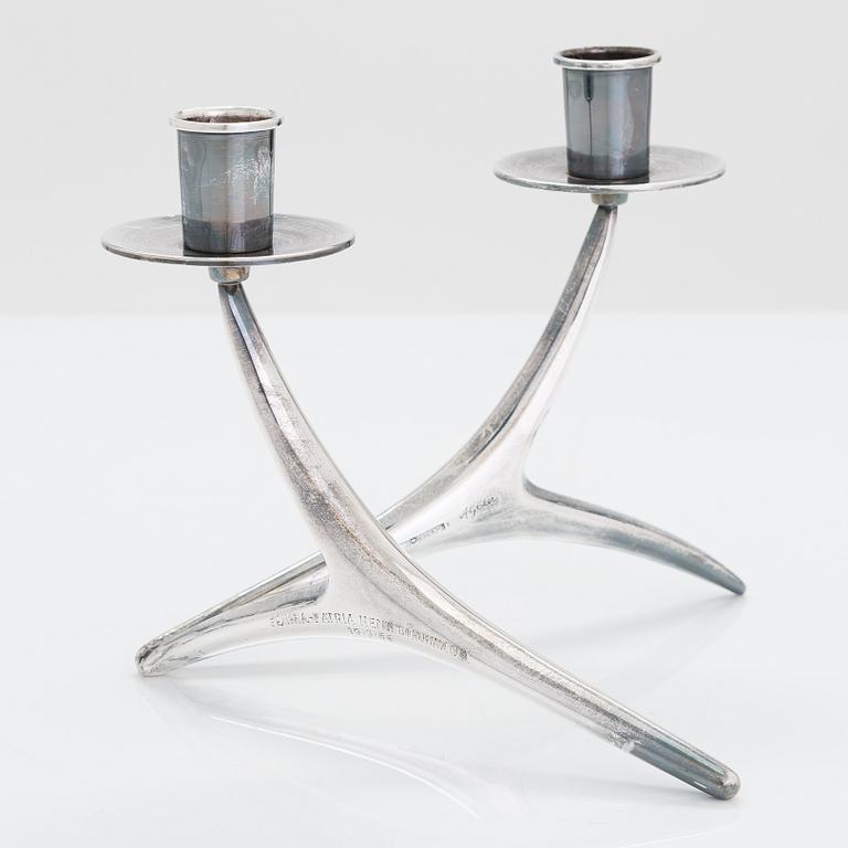 A 2-arm silver candle holder and a pair of silver candlesticks, Anna-Greta Eker and Hopearae Lasander, Turku 1965, 1963.