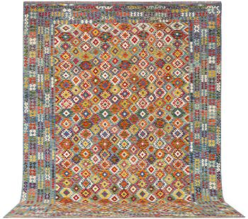 An Afghan kelim carpet, c. 397 x 308 cm.