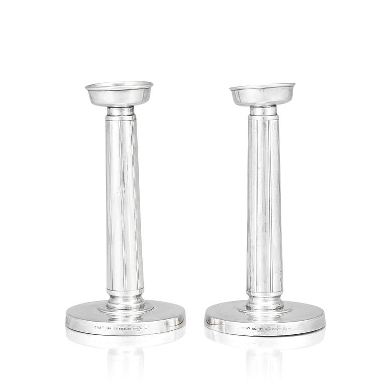 Gustaf Janson, a pair of sterling candlesticks, C.G Hallberg Stockholm 1961.