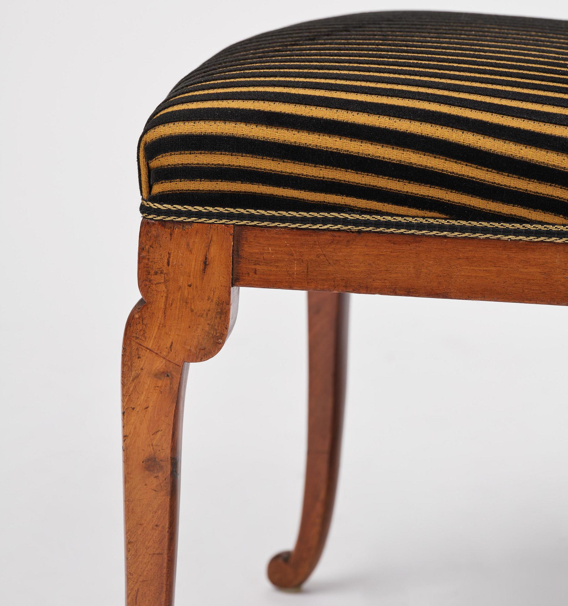 A set of nine Charles X mahogny dining chairs.