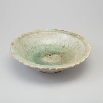 A Sawankhalok celadon dish, 15th century.