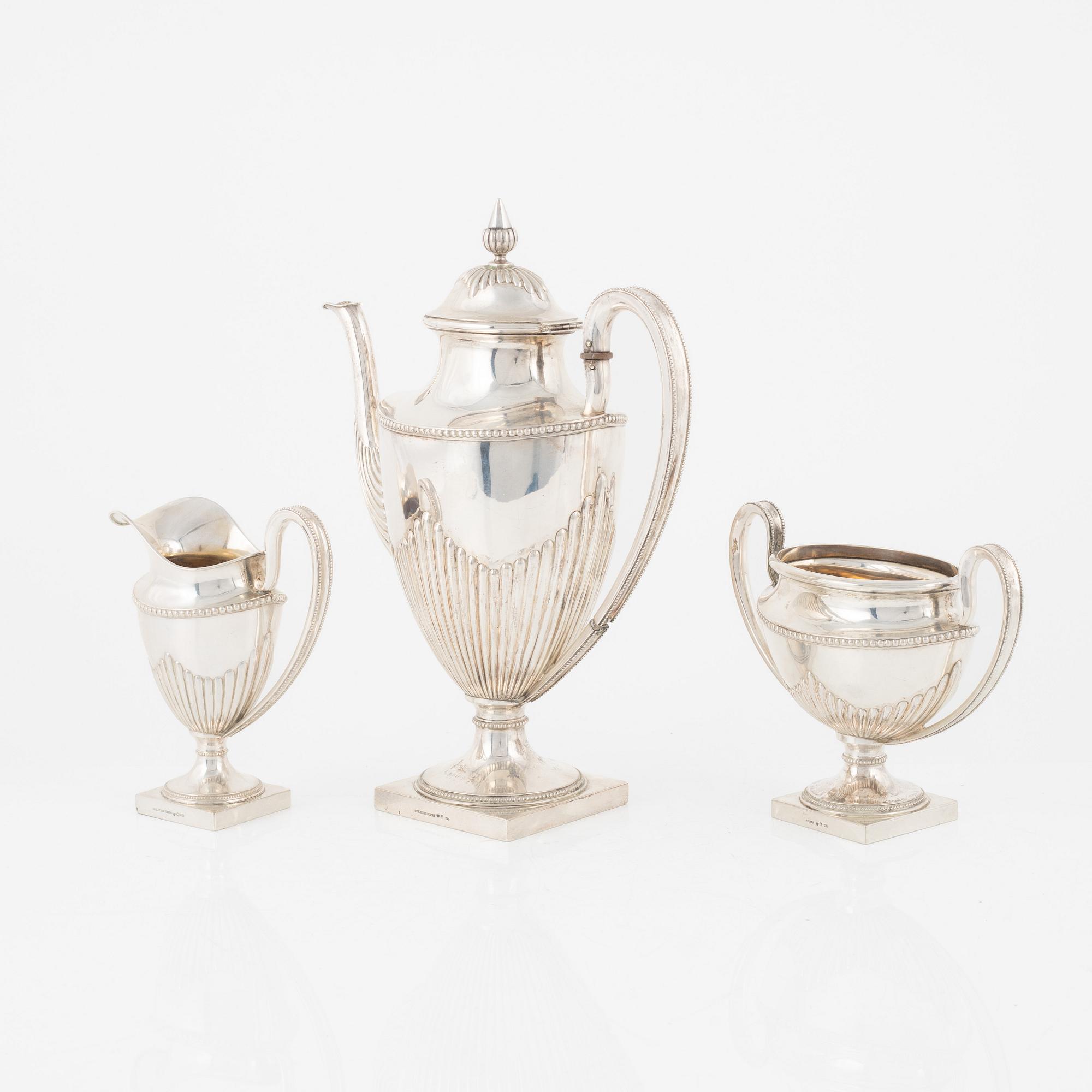 A Swedish Silver Coffee Pot, Creamer and Sugar Bowl, mark of Ludvig Axelson Jr, Stockholm 1899.