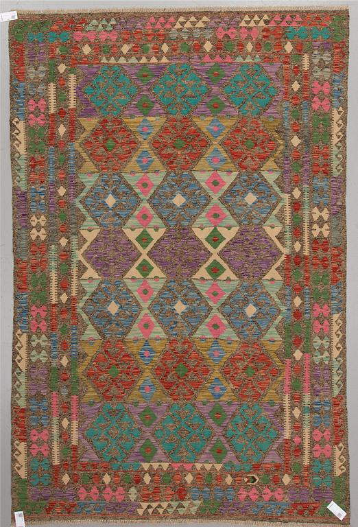 An oriental kilim, around 297 x 195 cm.