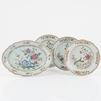 A set of three famille rose 'double peacock' dinner plates and an odd serving dish, Qing dynasty, Qianlong (1736-95).