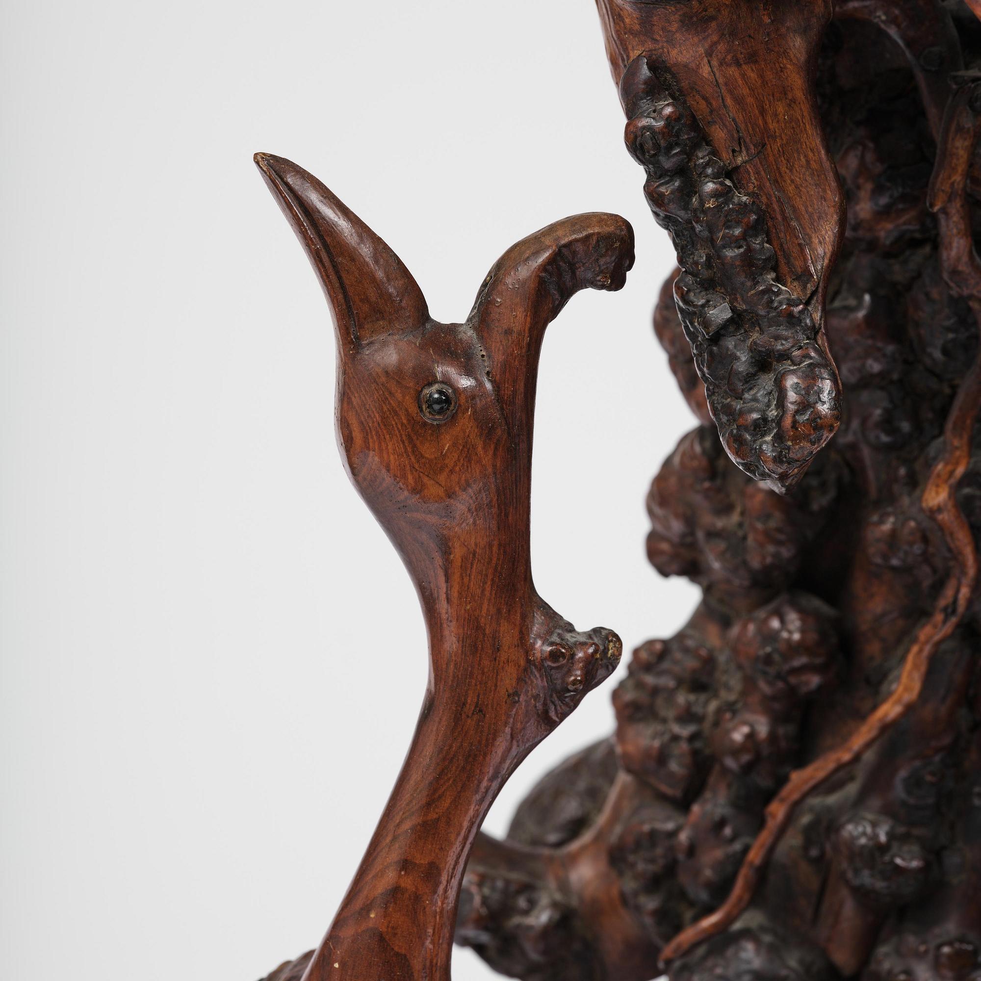 A large well sculptured root sculpture of 'Sholau and attendant', late Qing dynasty, 19th century.