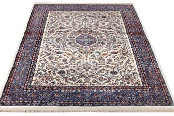 An oriental carpet with a Kerman pattern, c. 308 x 220 cm.