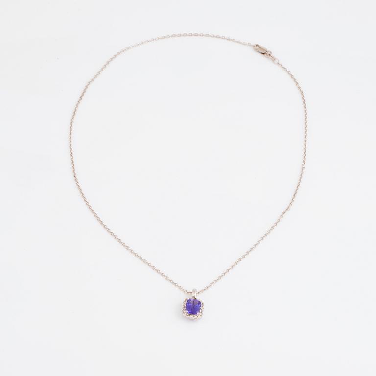 An 18K white gold necklace set with a faceted tanzanite.